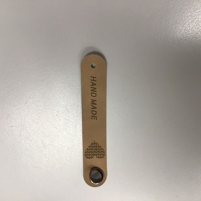 Hovedbilde Lapp  kunstskinn «Handmade» med metallfeste Beige